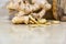Ginger root Zingiber officinale on light and woody background