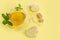 Ginger tea with lemon in glass Cup with brown organic sugar and mint on yellow paper background