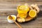 Ginger tea with lemon and honey on a wooden background. Hot healthy winter drink