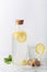 Ginger Water with Lemon and Honey in a Glass Bottle, Vertical Orientation