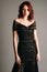 Ginger woman in maxi black gown. Candid portrait. Transparent slim shiny dress with v neckline. Stunning look for an event, female