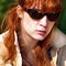 Ginger woman in sunglasses