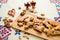 Gingerbread with almonds on a wooden tray and a decorative cloth