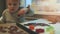 Gingerbread baking - child pushing shapes out of dough on the kitchen table