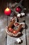 Gingerbread christmas horse with candle cinnamon stars pine twig christmas bulb on wooden floor