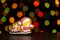 Gingerbread cookie of little postman  Santa over defocused colored lights of garland. Traditional Christmas food. Christmas and