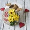 Gingerbread cookies casket with decor on 8 March holiday - yellow daffodils, red hearts cookies, butterflies, the inscription in
