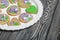 Gingerbread cookies decorated with glaze. On some ribbons tied to a bow. Gingerbread cookies are round and in the shape of a heart