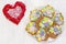 Gingerbread cookies in the form of baskets with flowers on a white wooden background.  Congratulations on Mothers Day, March 8,