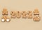Gingerbread cookies in the form of numbers, Happy New Year 2022, gingerbread man and woman, suitcase and car on beige background