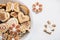 Gingerbread cookies in the shape of Easter bunny, heart, butterfly and flowers, covered with white and chocolate icing-sugar