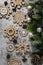 Gingerbread cookies, snowflakes shaped with icing, fir branch. Abstract Christmas food, cookies. Top view