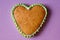 Gingerbread copy space. Baking heart close-up. Valentines day card. Pink background for the inscription. Place under text on cake