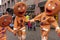 Gingerbread costume people dancing and acting on a city street, during Yaletown CandyTown in