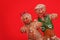 Gingerbread Couple over Red Background. Christmas Cookies