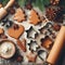 Gingerbread dough with metal cutters in different shapes for christmas cookies and wooden rolling pin, anise, ginger, cinnamon,