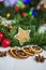 Gingerbread in the form of stars, red Christmas balls, dried lemons, cinnamon and green garland and lights