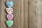 Gingerbread hearts left on wooden background