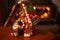 Gingerbread house with candy decorations cozy bokeh holiday fireplace