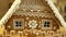 Gingerbread house and cottage cake beautiful, a fence with a piggy bank, decorated with a confectionery white icing with