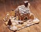 Gingerbread house with glaze standing on table. Holiday mood