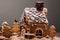 Gingerbread house with glaze standing on table. Holiday mood