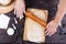 Gingerbread making. Woman rolling the dough with rolling pin on