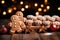 Gingerbread man cookies and homemade cakes against a bokeh background of Christmas lights