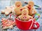 Gingerbread man cookies in red cup, Christmas holiday baking background