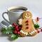 Gingerbread man and cup of coffee on the table. Christmas food and drink concept