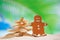 gingerbread man and starfish christmas tree on beach with seascape background