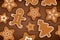 Gingerbread man on wooden table background. Merry christmas holiday card with homemade cookies.