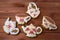 A gingerbread royal icing tea set of two cup of tea, jug of milk and teapot