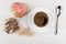 Gingerbread, sugar, coffee in cup on saucer, spoon on table