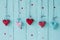 Gingham love red hearts on rustic wood texture background.