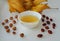 Ginseng oolong Chinese tea on a white plate with nuts, autumn leaves