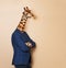 Giraffe headed businessman with his arms folded