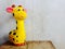 giraffe statue ceramic with space copy on wooden background