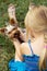 Girl 5 years old back to camera plays with Yorkshire Terrier