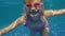 Girl 6 years of fun in the pool, dives. Underwater video