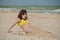 Girl 9 years old at sea. The portrait of the young girl about 9-12 years old. Teenager summer vacation sand. Sunny day