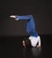 Girl acrobat, gymnastics, a young athlete in a blue and white suit , practicing acrobatics.  images on white background