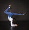 Girl acrobat, gymnastics, a young athlete in a blue and white suit , practicing acrobatics. Isolated images on white background