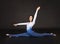 Girl acrobat, gymnastics, a young athlete in a blue and white suit , practicing acrobatics. Isolated images on white background