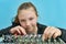 A girl adjusts the equalizer of a mixing console in a music stud