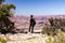 The girl admires the view from the edge of the cliff at the Grand Canyon in the USA