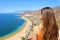 A girl admiring amazing landscape on Tenerife island. View from the back