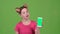 Girl advertises the phone. Green screen. Slow motion