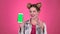 Girl advertises the phone. Pink background