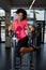 Girl with afro hair working out with her abdominal muscles for beautiful figure